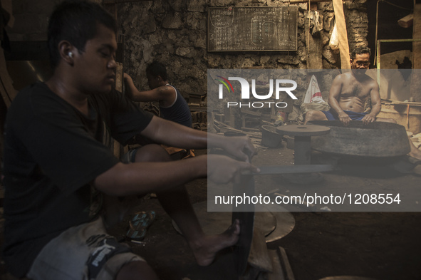 Workers forge gamelan in Gamelan Daliyo Legiyono, Pelem Lor Batu Retno Village, Banguntapan, Yogyakarta, Indonesia, on May 13, 2016. Gamelan...