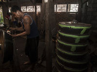 A worker forge gamelan in Gamelan Daliyo Legiyono, Pelem Lor Batu Retno Village, Banguntapan, Yogyakarta, Indonesia, on May 13, 2016. Gamela...