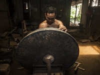 A worker forge gamelan in Gamelan Daliyo Legiyono, Pelem Lor Batu Retno Village, Banguntapan, Yogyakarta, Indonesia, on May 13, 2016. Gamela...