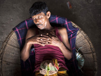 DHAKA, BANGLADESH - MAY 12: Labourers of Karwan Bazar break for a mid-day siesta to beat the hot summer noon in their workplace at Karwan Ba...