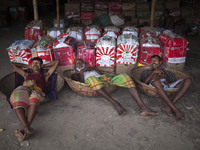 DHAKA, BANGLADESH - MAY 12: Labourers of Karwan Bazar break for a mid-day siesta to beat the hot summer noon in their workplace at Karwan Ba...