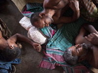 DHAKA, BANGLADESH - MAY 12: Labourers of Karwan Bazar break for a mid-day siesta to beat the hot summer noon in their workplace at Karwan Ba...