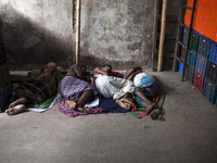 DHAKA, BANGLADESH - MAY 12: Labourers of Karwan Bazar break for a mid-day siesta to beat the hot summer noon in their workplace at Karwan Ba...