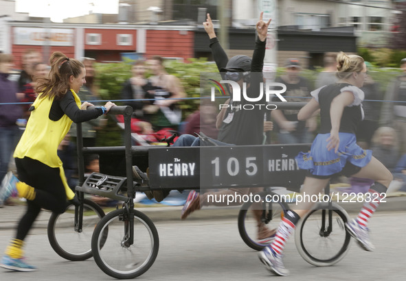 People participate the 39th Cloverdale Bed Race in Surrey, Canada, May 19, 2016.