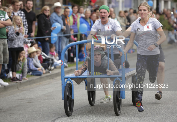 People participate the 39th Cloverdale Bed Race in Surrey, Canada, May 19, 2016.