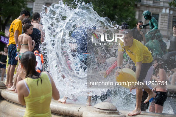 Young people participate in a water fight flashmob in Budapest, Hungary, June 25, 2016. The event was organized by young people on Facebook...