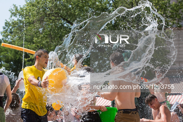 Young people participate in a water fight flashmob in Budapest, Hungary, June 25, 2016. The event was organized by young people on Facebook...