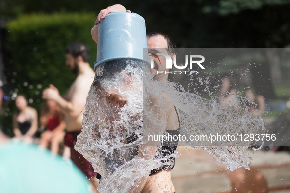 Young people participate in a water fight flashmob in Budapest, Hungary, June 25, 2016. The event was organized by young people on Facebook...