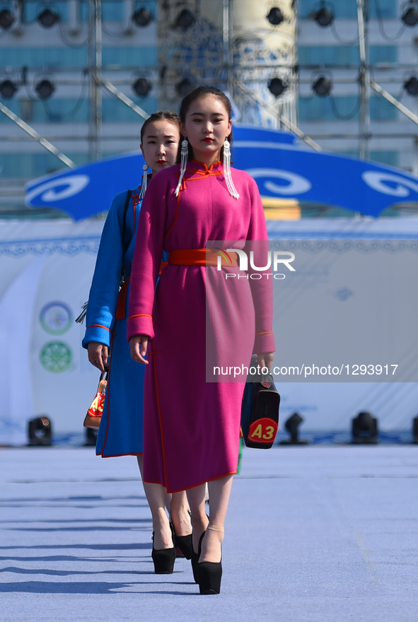 Models present costumes at Sino-Russian-Mongolian Costume Festival in Hulunbuir, north China's Inner Mongolia Autonomous Region, June 24, 20...