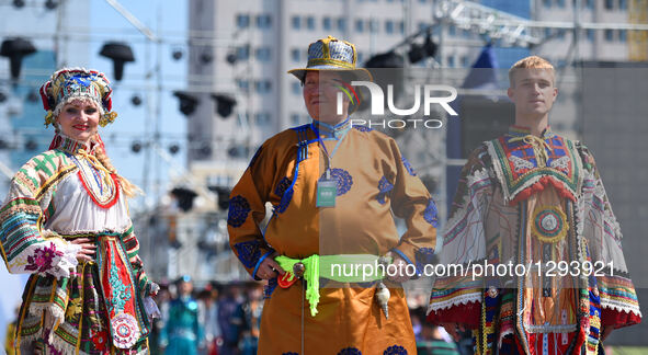 Models present costumes at Sino-Russian-Mongolian Costume Festival in Hulunbuir, north China's Inner Mongolia Autonomous Region, June 24, 20...