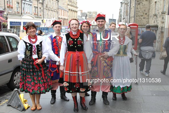 People take part in the celebration parade of the opening ceremony of the Scottish parliament in Edinburgh, Britain, on July 2, 2016. The fi...