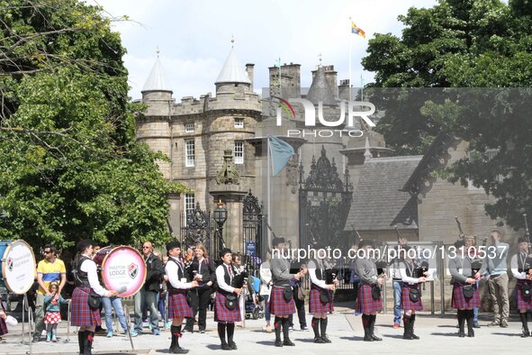 People take part in the celebration parade of the opening ceremony of the Scottish parliament in Edinburgh, Britain, on July 2, 2016. The fi...