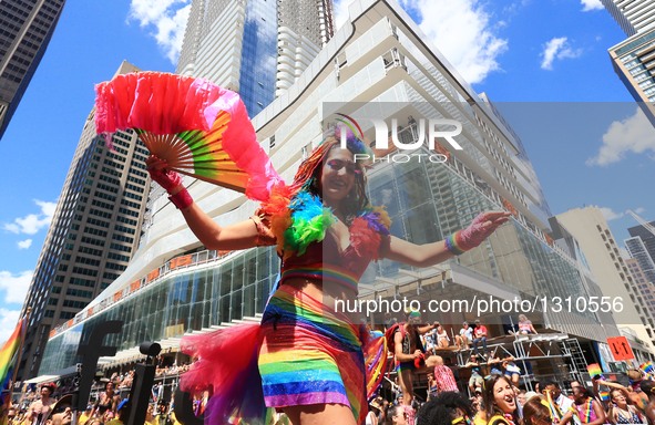 A reveller walks on stilts during the 2016 Toronto Pride Parade in Toronto, Canada, July 3, 2016.