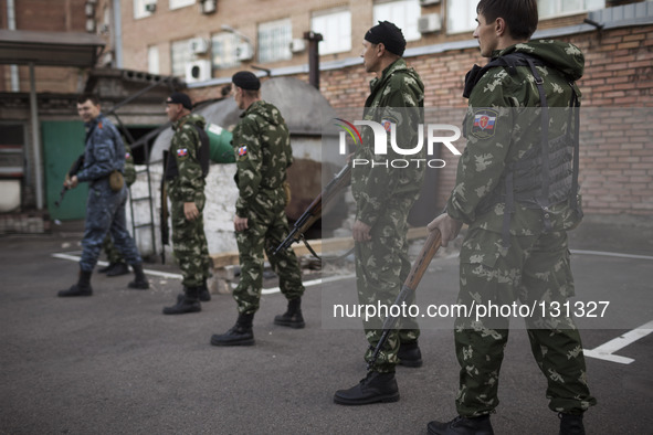 Militiamen from the Russian Orthodox Army undergo firearm training at the unit's headquarters in the occupied SBU building in Donetsk, easte...