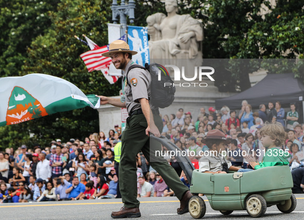 People take part in the Independence Day parade in Washington D.C., capital of the United States, July 4, 2016. The United States celebrated...