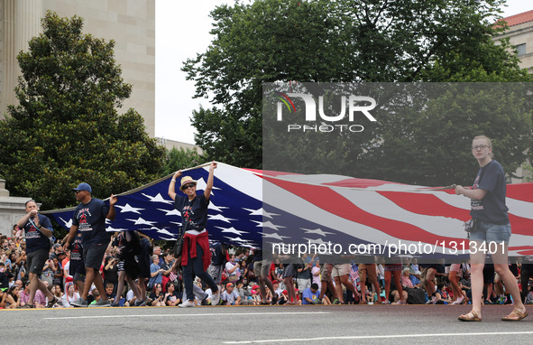 People take part in the Independence Day parade in Washington D.C., capital of the United States, July 4, 2016. The United States celebrated...