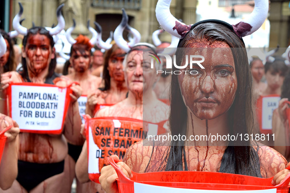 Activists From Around the World Descend on Pamplona's Main Square to Demand an End to Cruel Running of the Bulls on July 5, 2016. Wearing li...