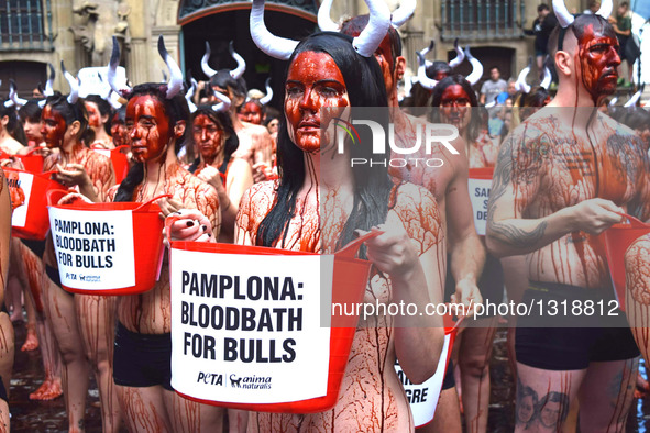 Activists From Around the World Descend on Pamplona's Main Square to Demand an End to Cruel Running of the Bulls on July 5, 2016. Wearing li...