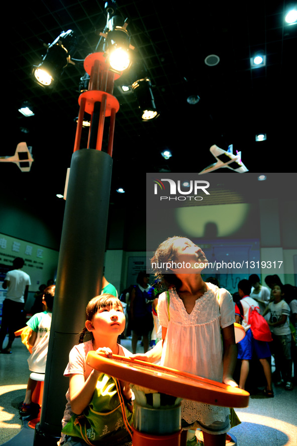 Children visit the Zhengzhou Science Museum during summer vacation in Zhengzhou, capital of central China's Henan Province, July 6, 2016.