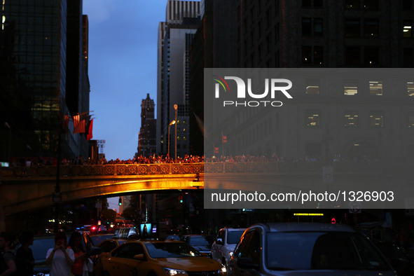 People take photos of Manhattanhenge in Manhattan, New York, the United States, on July 11, 2016.