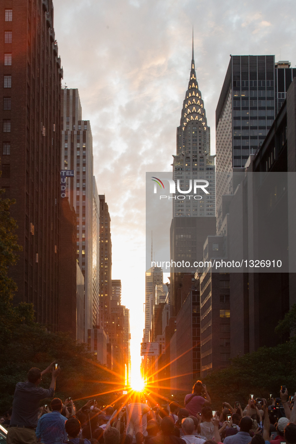 Photo taken on July 11, 2016 shows the Manhattanhenge in Manhattan, New York, the United States. The Manhattanhenge refers to the twice-a-ye...