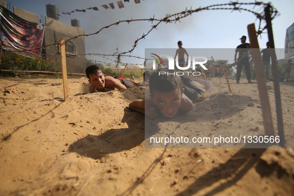 Palestinians take part in a military exercise at a summer camp, organized by Islamic Jihad movement, in the southern Gaza Strip City of Khan...