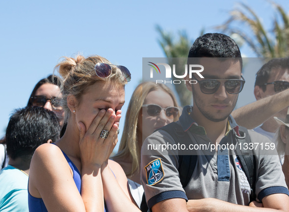 People gather to mourn victims of an attack in which a truck drove through crowds during Bastille Day celebrations in Nice, France on July 1...