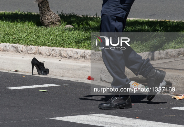 A victim's shoe is seen at the site of the terrorist attack in Nice, France, July 15, 2016. The death toll rises to 84 from an attack in whi...