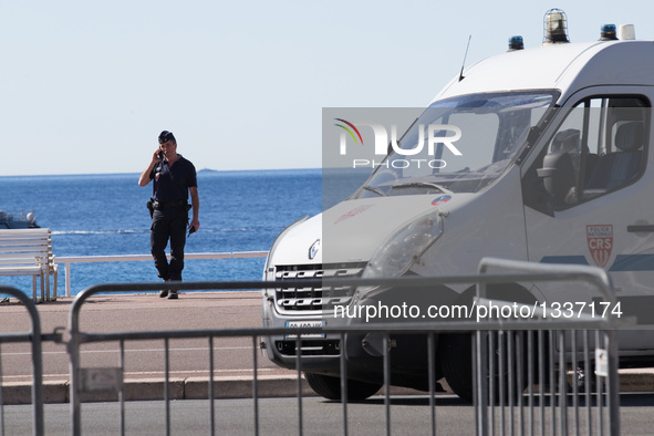 A member of security personnel stands guard on the Promenade des Anglais, where the attack took place on Thursday, in Nice, France, July 15,...