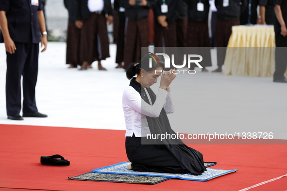 Myanmar's State Counselor Aung San Suu Kyi, daughter of General Aung San, pays respect during a ceremony to mark the 69th Martyrs' Day in Ya...