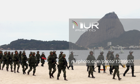 Members of the Brazilian marine corps scout on the beach, after disembarking from a drill against violent protests, near the National Monume...