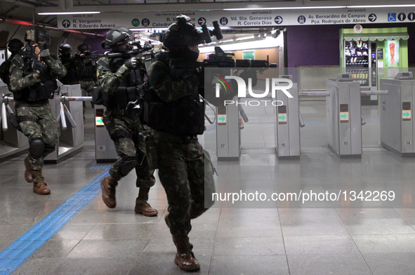 Members of security forces takes part in an anti-terrorism attack drill in Paraiso Metro Station, in Sao Paulo, Brazil, on July 20, 2016. Th...