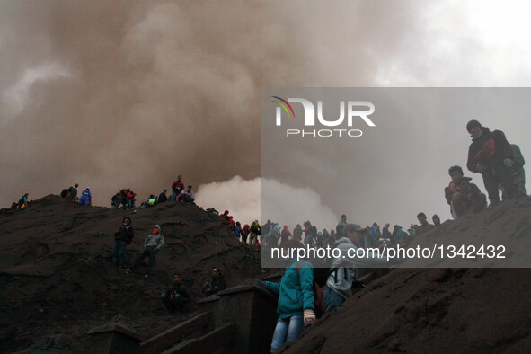 People hike to watch offerings thrown in Mount Bromo during the traditional Kasada festival in Probolinggo, East Java, Indonesia, July 21, 2...