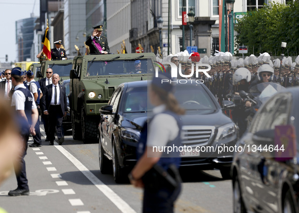 King Philippe of Belgium salutes as he inspects the Military Parade to celebrate Belgium's National Day to celebrate Belgium's National Day...