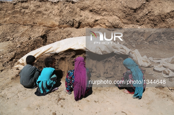 Afghan children work at a brick factory in Kabul, capital of Afghanistan, July 21, 2016. Some 1.3 million school-aged Afghan children are de...