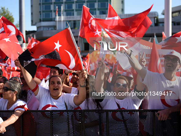 People attend a rally at Istanbul's Taksim square in Turkey, on July 24, 2016. Tens of thousands of Turks on Sunday flocked to a rally in Is...