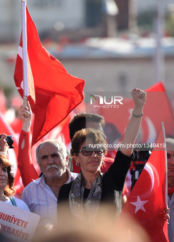 People attend a rally at Istanbul's Taksim square in Turkey, on July 24, 2016. Tens of thousands of Turks on Sunday flocked to a rally in Is...