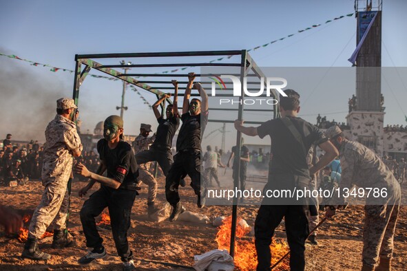 Palestinians show their skills during a military graduation ceremony as part of a military-style summer camp organized by Hamas's armed wing...