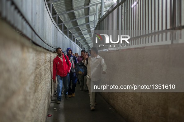 Palestinian labourers, working in Israel, make their way to their workplaces, through the main Israeli terminal in the West Bank city of Bet...