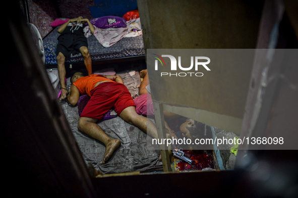 (EDITORS NOTE: Image depicts graphic content.) The corpses of suspected drug pushers lie inside a house after they were shot dead following...