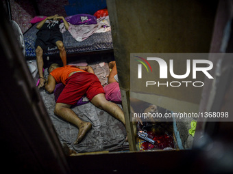 (EDITORS NOTE: Image depicts graphic content.) The corpses of suspected drug pushers lie inside a house after they were shot dead following...