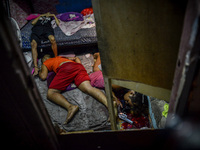 (EDITORS NOTE: Image depicts graphic content.) The corpses of suspected drug pushers lie inside a house after they were shot dead following...