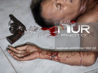 (EDITORS NOTE: Image depicts graphic content.) A sachet of crystal meth known locally as "shabu" and a revolver lies next to the corpse of a...