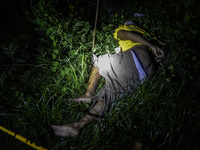 (EDITORS NOTE: Image depicts graphic content.) The corpse of a suspected drug pusher and victim of a vigilante-style execution with his hand...