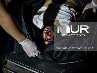 (EDITORS NOTE: Image depicts graphic content.) The corpse of a suspected drug pusher and victim of a vigilante-style execution is placed in...