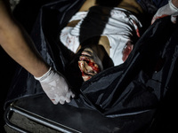 (EDITORS NOTE: Image depicts graphic content.) The corpse of a suspected drug pusher and victim of a vigilante-style execution is placed in...