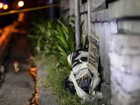 (EDITORS NOTE: Image depicts graphic content.) The corpse of a suspected drug pusher and victim of a vigilante-style execution with his body...