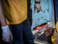 (EDITORS NOTE: Image depicts graphic content.) Blood drips from inside a house where suspected drug pushers were shot dead following a polic...