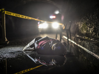 (EDITORS NOTE: Image depicts graphic content.) The corpse of a suspected drug pusher and victim of a vigilante-style execution with his hand...