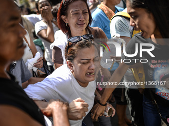 Relatives of a suspected drug pusher and victim of a vigilante-style execution grieve during a burial ceremony in Pasay, south of Manila, Ph...